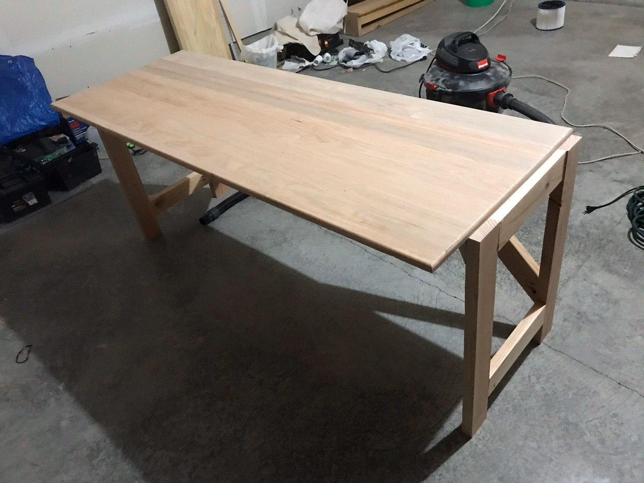 Jointed desk surface on frame