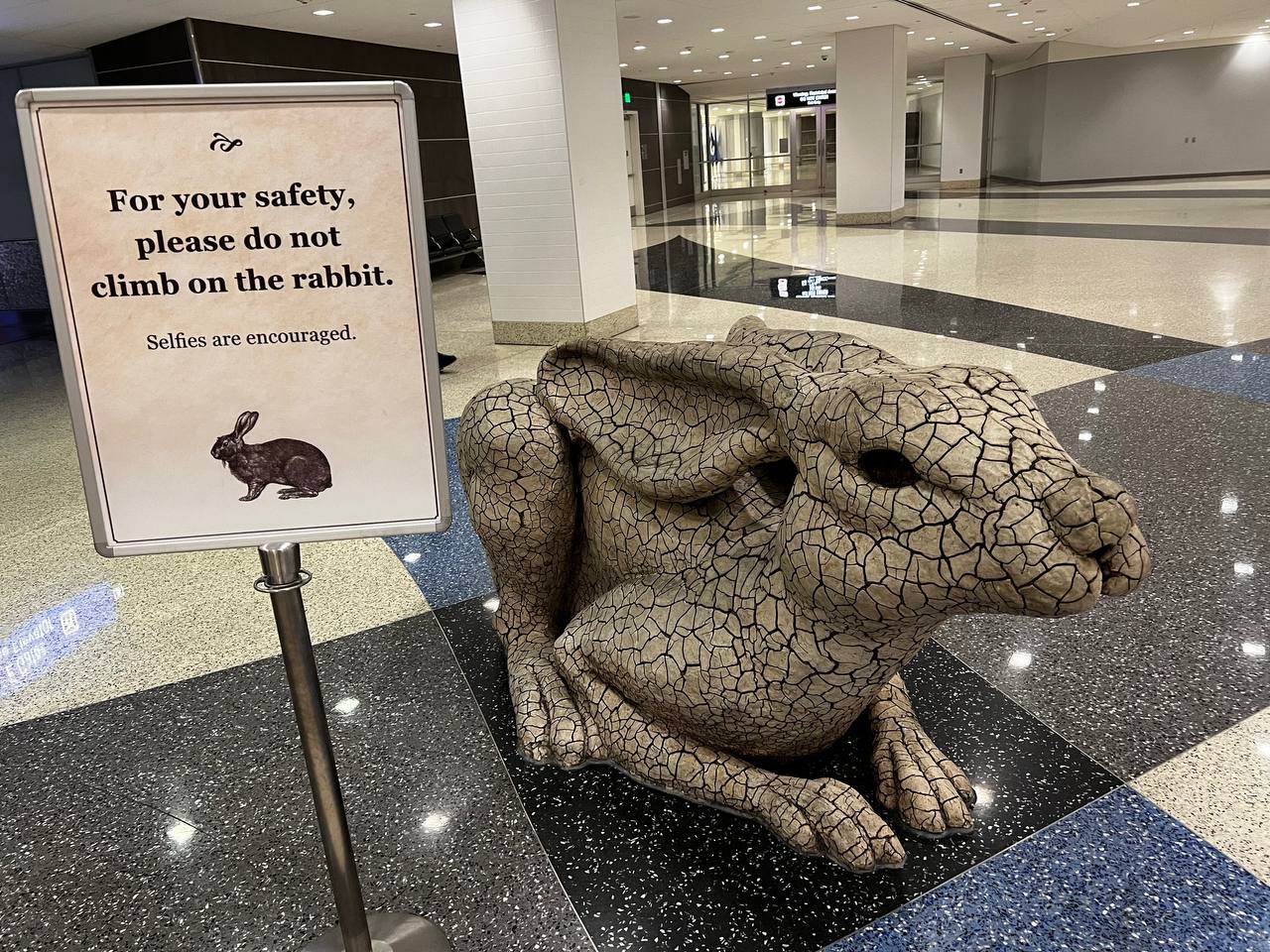 A rocky rabbit with text next to it reading for your safety please do not climb